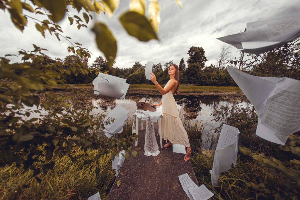 Woman Stands Bridge Front Lake Is Surrounded By Paper Sheets