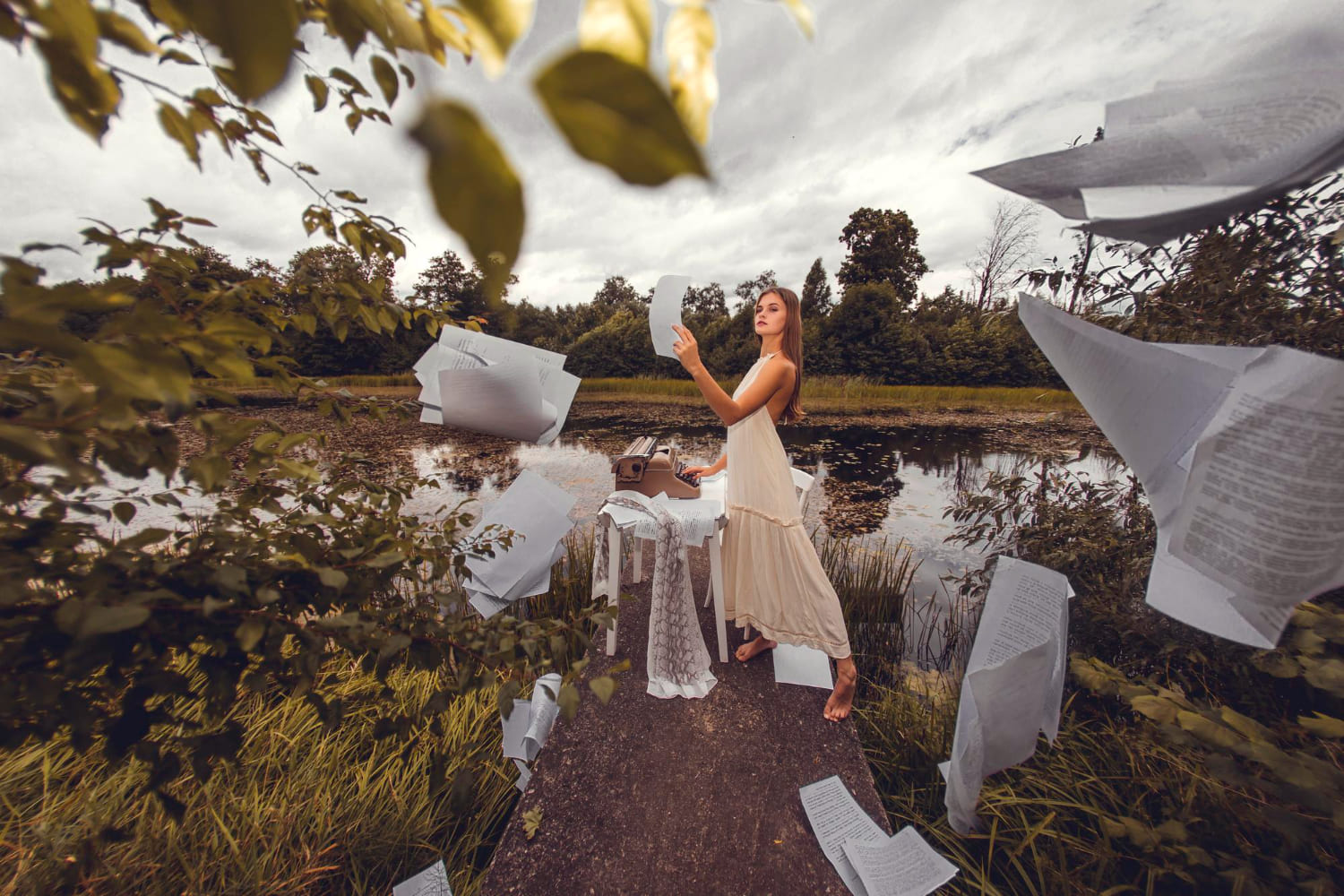 Woman Stands Bridge Front Lake Is Surrounded By Paper Sheets (1)