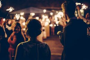 Wedding in Marseille: bride and groom from behind at night with soft lighting