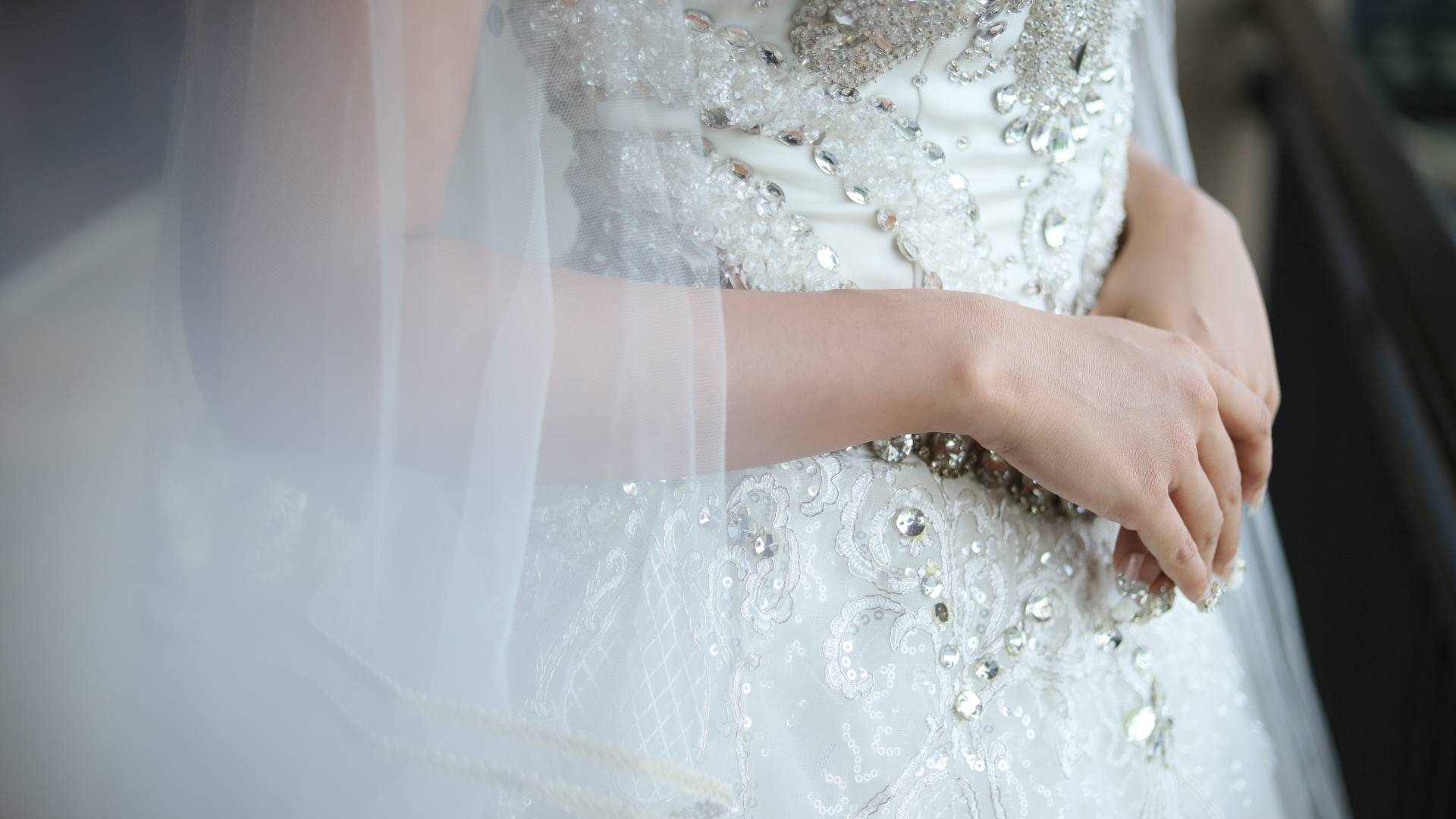 Woman in wedding dress walking towards the altar